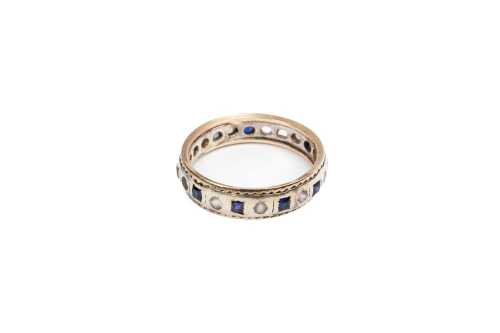 A sapphire and white quartz ring in 9 carat yellow gold
