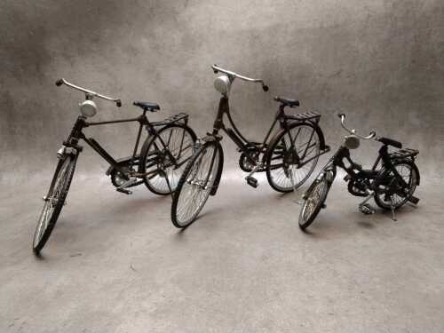 Three metal miniature bicycle models