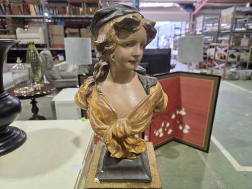 Plaster bust of a young woman