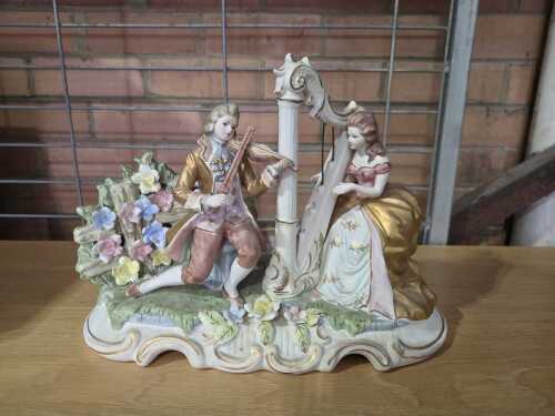 Baroque-style ceramic musical figure