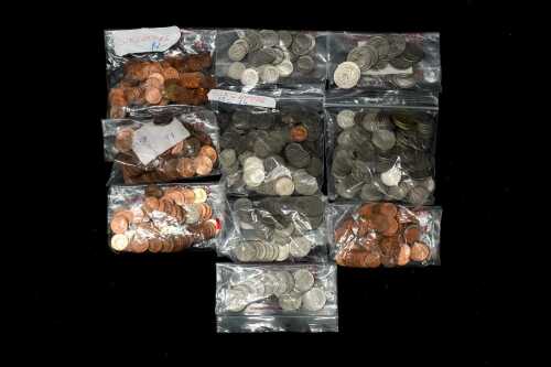 Collection of assorted Singapore and USA coins.