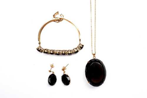 Collection of smoky quartz jewellery in gold tone metal