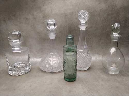 Four crystal and glass decanters with a Manallack St. Arnaud codd bottle