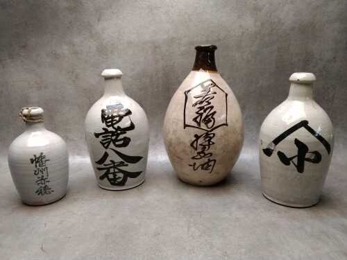 Four Japanese earthenware sake flasks