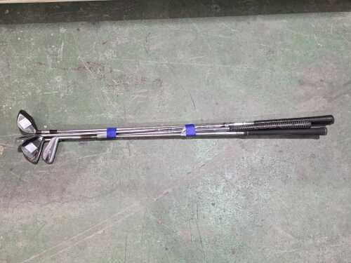 Five golf clubs including Spalding