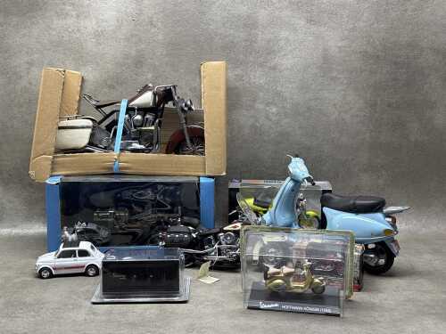 Collection of model motorbikes, including 'Laurel and Hardy Go To Sea'