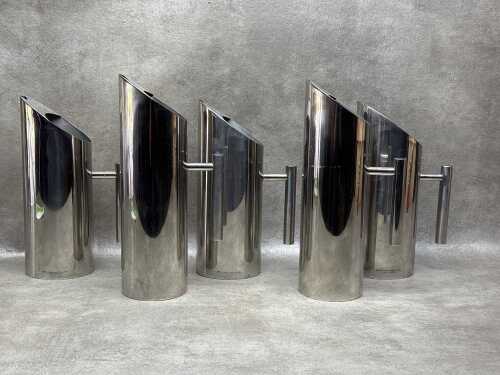 Five contemporary stainless steel water jugs