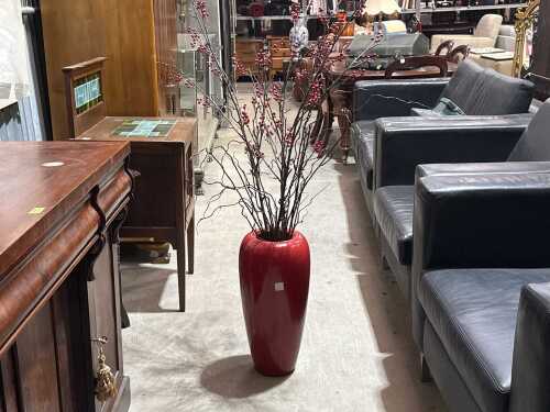 Red vase with decorative flowers