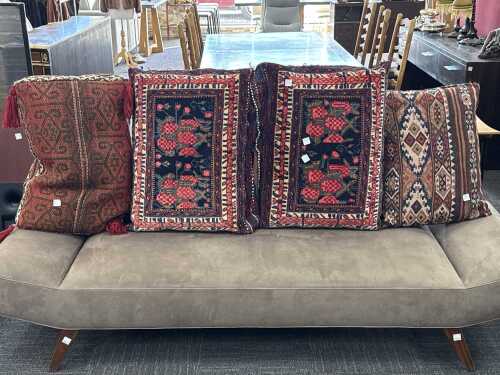 Four tribal woven carpet cushions