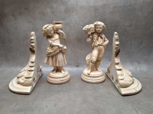 Two plaster figure with matching wall brackets