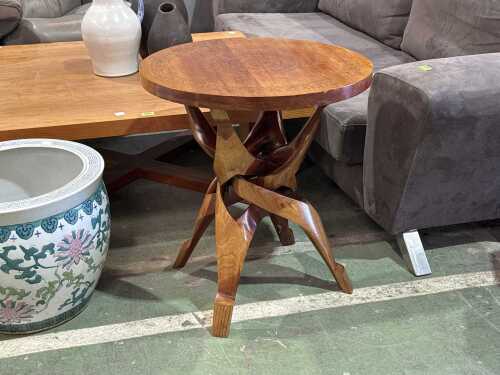 Carved timber table with ornate top