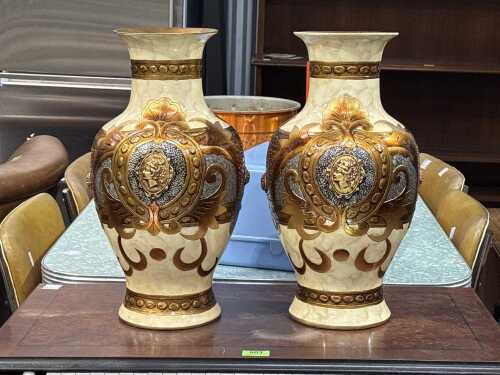 Pair of decorative neo-classical-style urns with gilded central cameos
