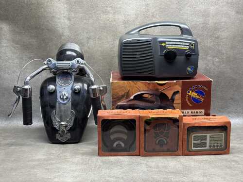 Assorted vintage radios including novelty Harley Davidson Tank Radio, a Freeplay self-powered wind-up radio