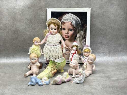 Collection of miniature porcelain doll figures and ornaments
