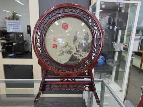 Oriental round table screen with landscape design.