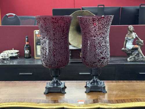 Pair of etched ruby glass hurricane lanterns with classical metal base