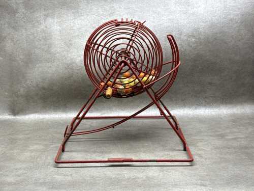 Red bingo cage with coloured balls