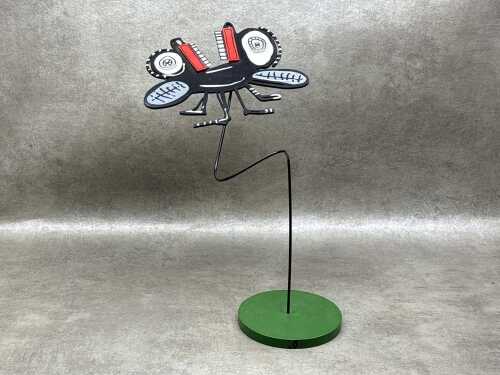 In the style of Anthony Breslin, fly sculpture