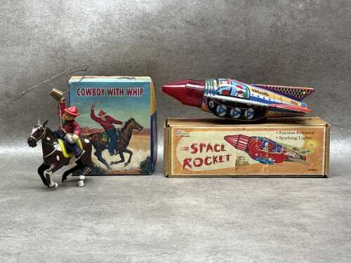 Two boxed tin toys