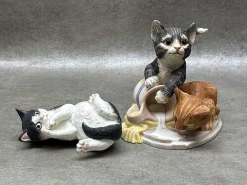 Two porcelain cat figures including Royal Worcester and Franklin Mint