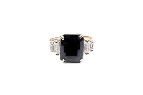 A sapphire and cubic zirconia ring in 9 carat yellow gold