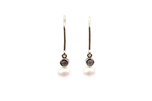 A pair of pearl and cubic zirconia earrings in 9 carat yellow gold