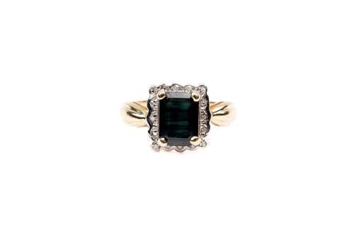 A sapphire and diamond ring in 9 carat yellow gold