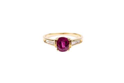 A ruby and diamond ring in 18 carat yellow gold