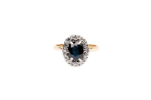 A sapphire and diamond ring in 18 carat yellow gold