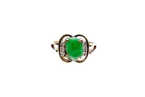 A jade and diamond ring in 14 carat yellow gold