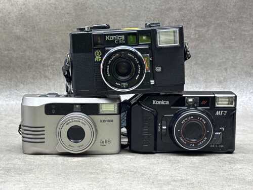 Three Konica point and shoot 35mm film cameras