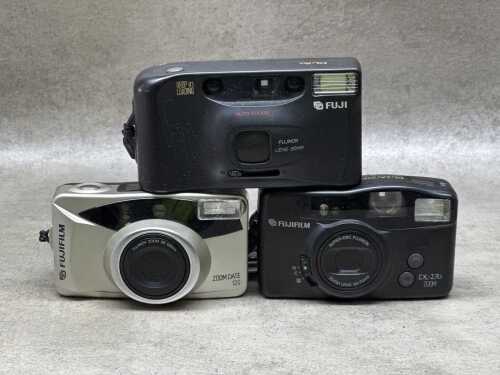 Three Fujifilm point and shoot 35mm film cameras