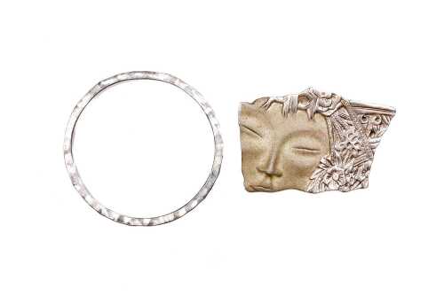 A bangle and brooch in sterling silver