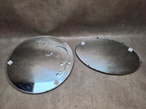 Two hanging mirrors including oval and round