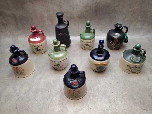 Nine stoneware decanters