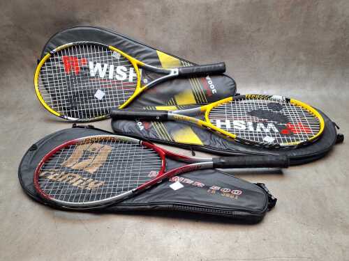 Three tennis rackets, including Wilson Wish