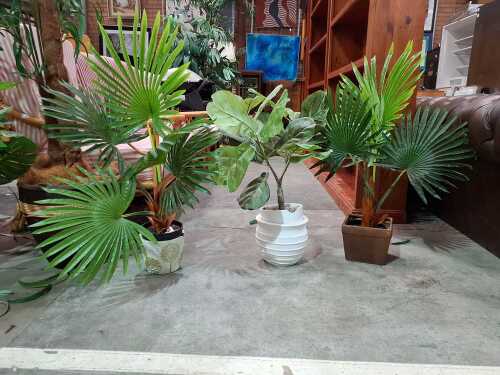 Two potted faux plants