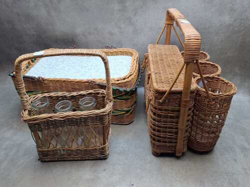 Three wicker picnic baskets and drink carriers.
