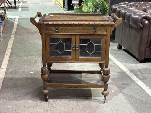 A 1940s oak leadlight auto trolley