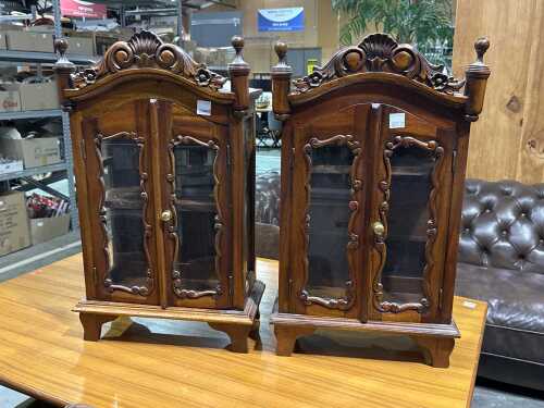 Pair of timber wall-hanging curio cabinets with glass panel doors