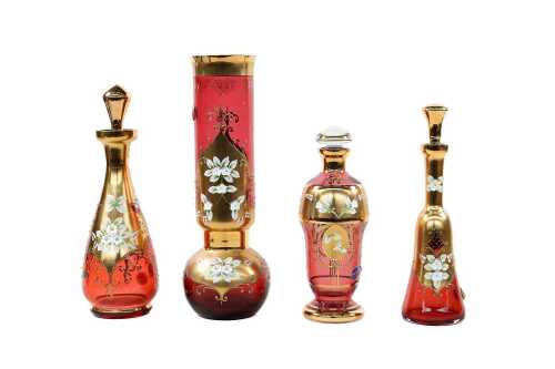 Four vintage Bohemian cranberry glass vase and decanters