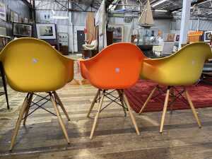 Three replica Eames moulded plastic armchairs - 3