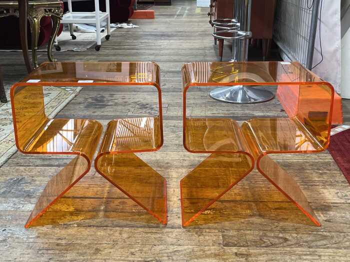 Pair of orange bent acrylic bedside tables