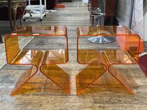 Pair of orange bent acrylic bedside tables