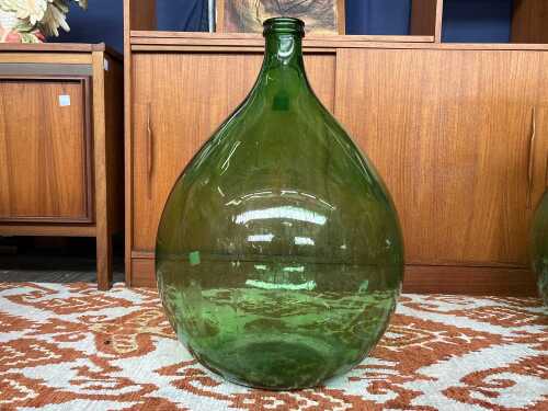 Vintage demijohn glass bottle in green