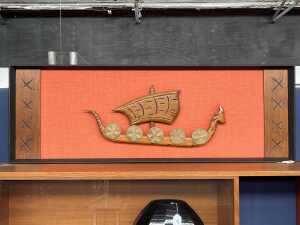 Mid-century wall panel with carved timber Viking ship