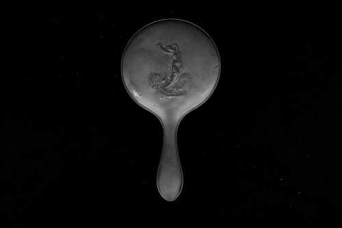 Antique English sterling silver mounted hand mirror with Art Nouveau design of a lady