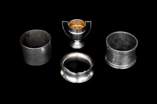 Four English sterling silver pieces including trophy and napkin rings, weight of silver 91g