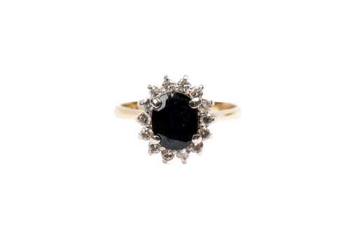 A vintage sapphire and diamond ring in 14 carat yellow gold