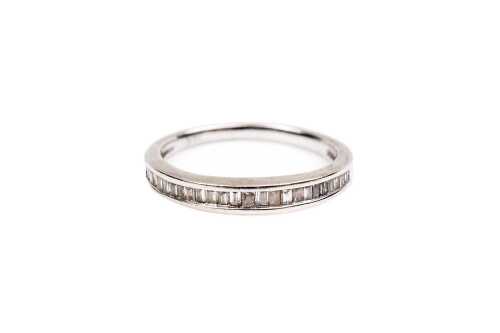 A diamond band in 14 carat white gold